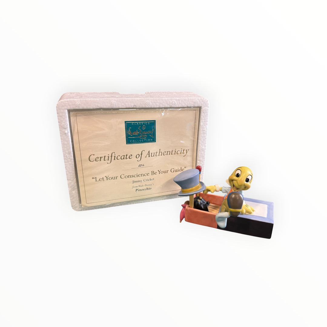 Walt Disney Classics Collection Figurine "Let Your Conscience Be Your Guide," featuring Jiminy Cricket from Pinocchio.