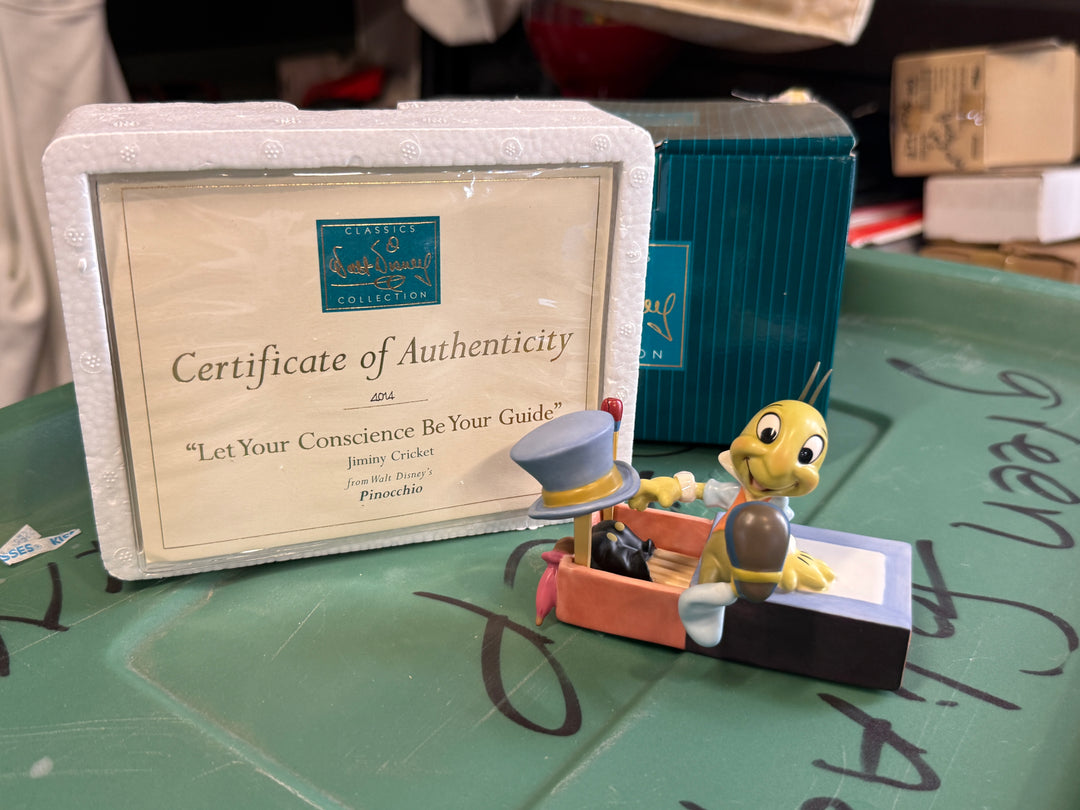 Walt Disney Classics Collection Figurine "Let Your Conscience Be Your Guide," featuring Jiminy Cricket from Pinocchio.