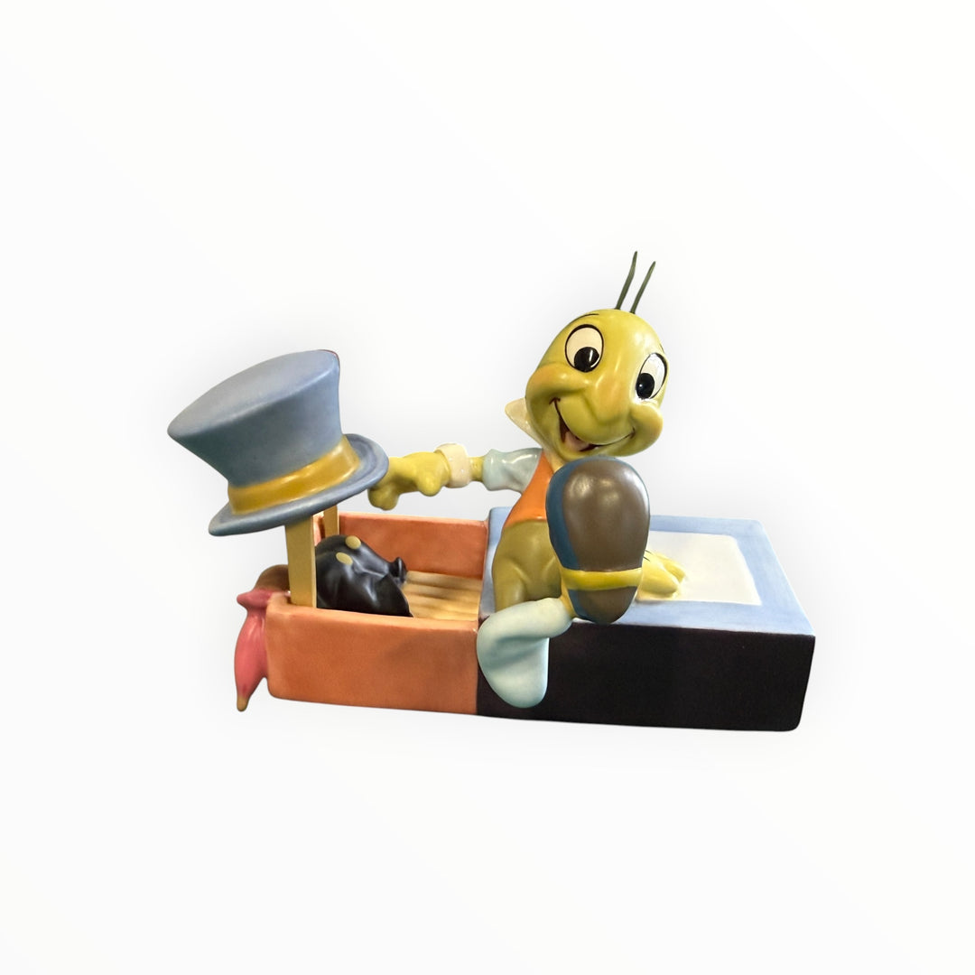Walt Disney Classics Collection Figurine "Let Your Conscience Be Your Guide," featuring Jiminy Cricket from Pinocchio.