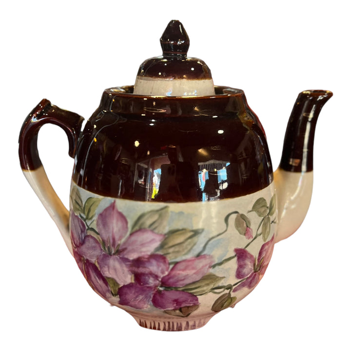 Teapot with purple floral accents